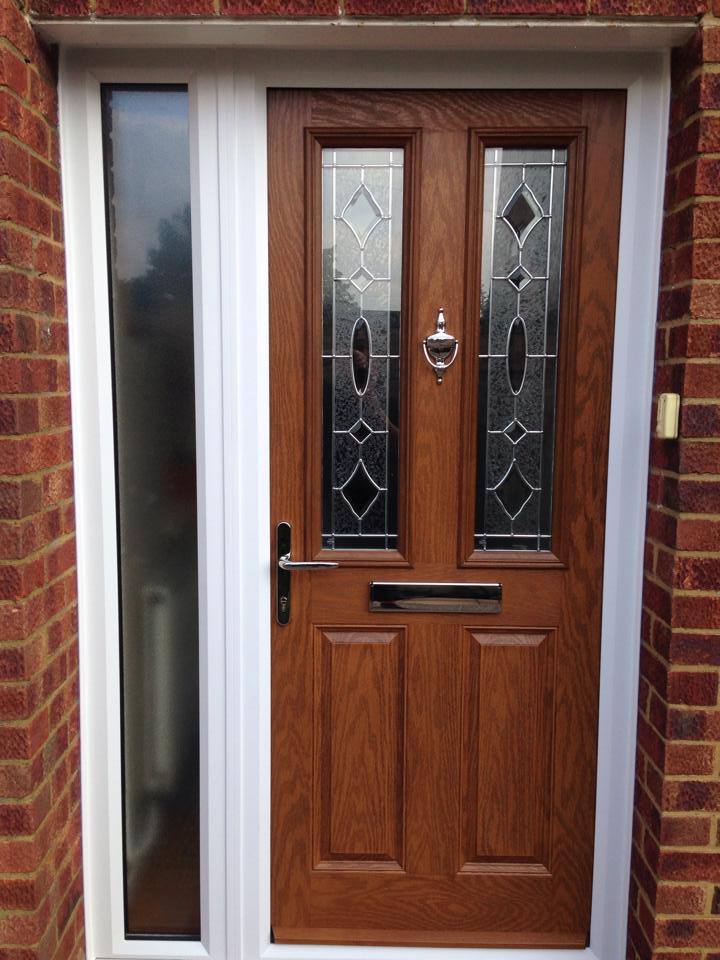 Oak composite front door with zinc art clarity glass, finished with contemporary chrome furniture.