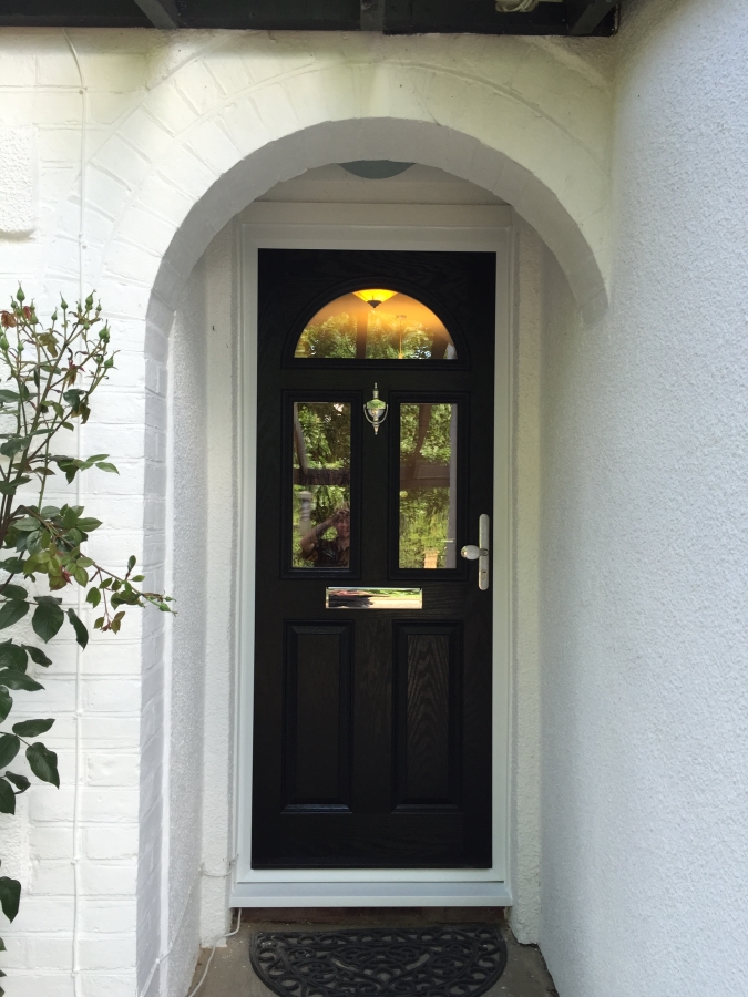 Black composite front door with chrome furniture